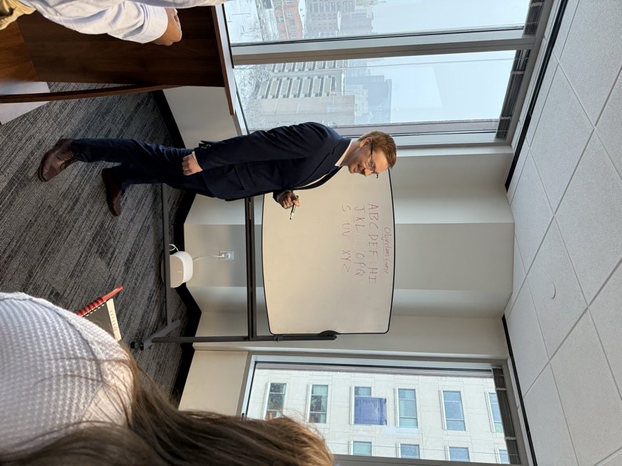 Rochester Talent Group trainer leading a team training session at the whiteboard